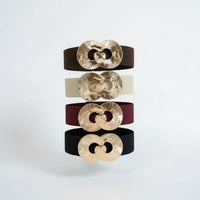 Four belts with gold circular buckles 73 cm