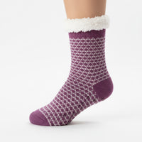 Purple patterned sock with white trim on a white background