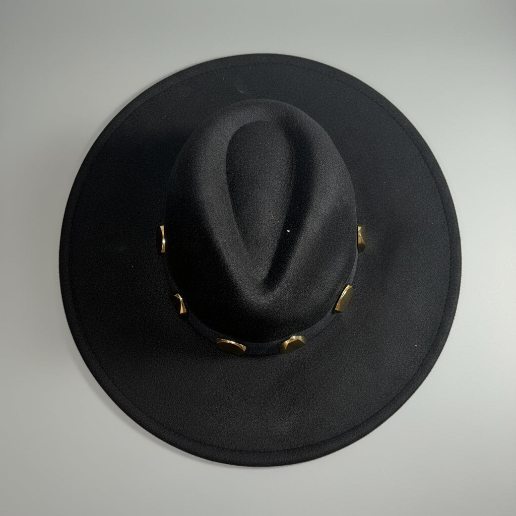 Black hat with gold band on a light gray background