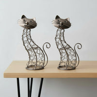 Two wire cat sculptures artisans in Bali