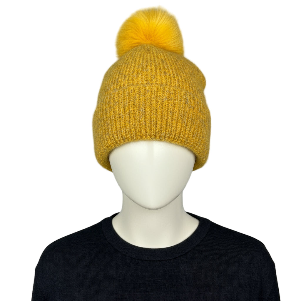 mustard  knit beanie with a pom-pom 