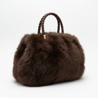 Soft, stylish, and versatile — this large fluffy handbag features two sturdy handles for easy carrying