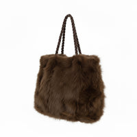 Soft, stylish, and versatile — this large fluffy handbag features two sturdy handles for easy carrying