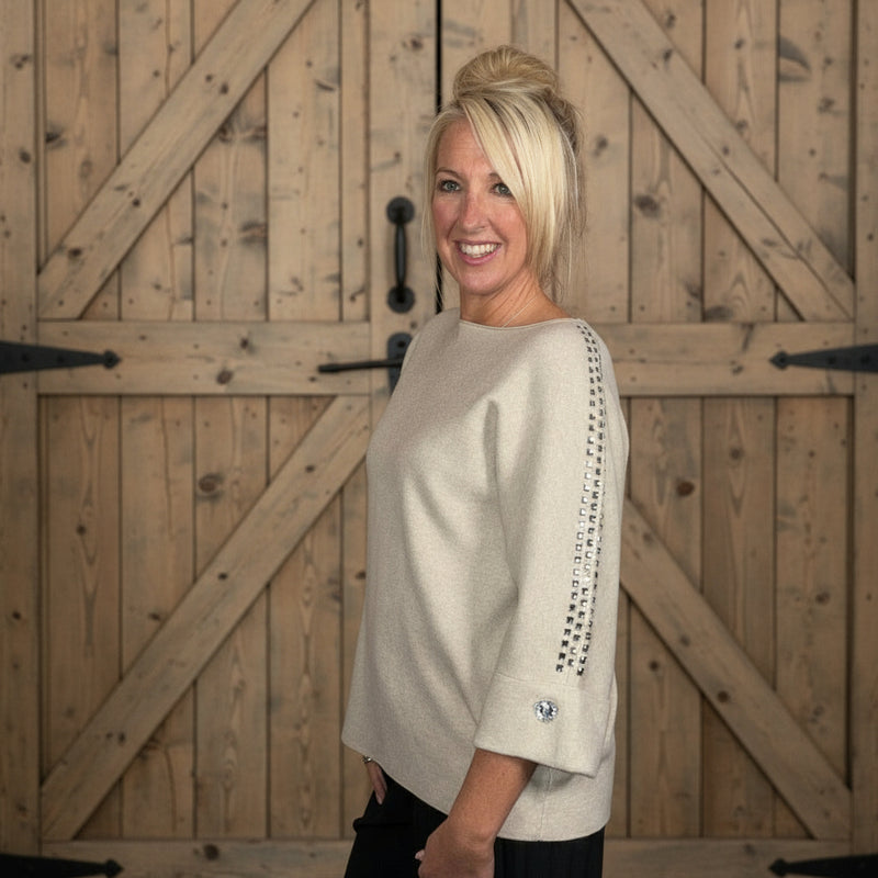 beige sweater with heart jewels