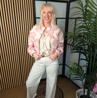 Lady wearing jacket and pin stripe jeans 