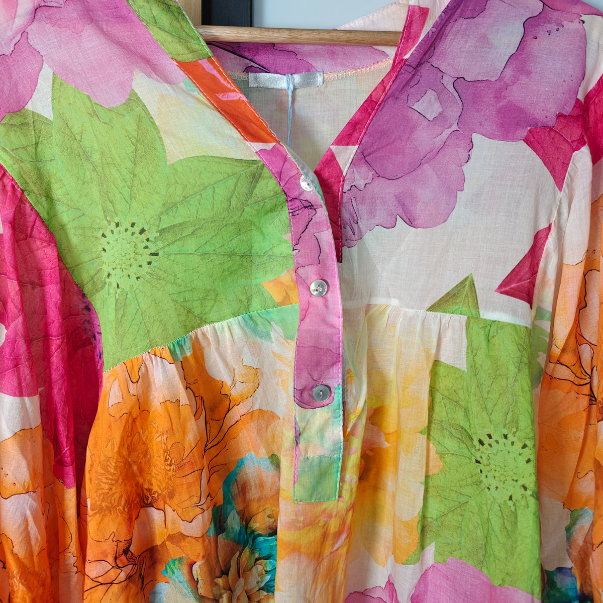 Bright colours blouse with flowers buttons 