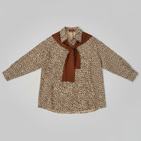 leopard print shirt and brown scarf Swade feel