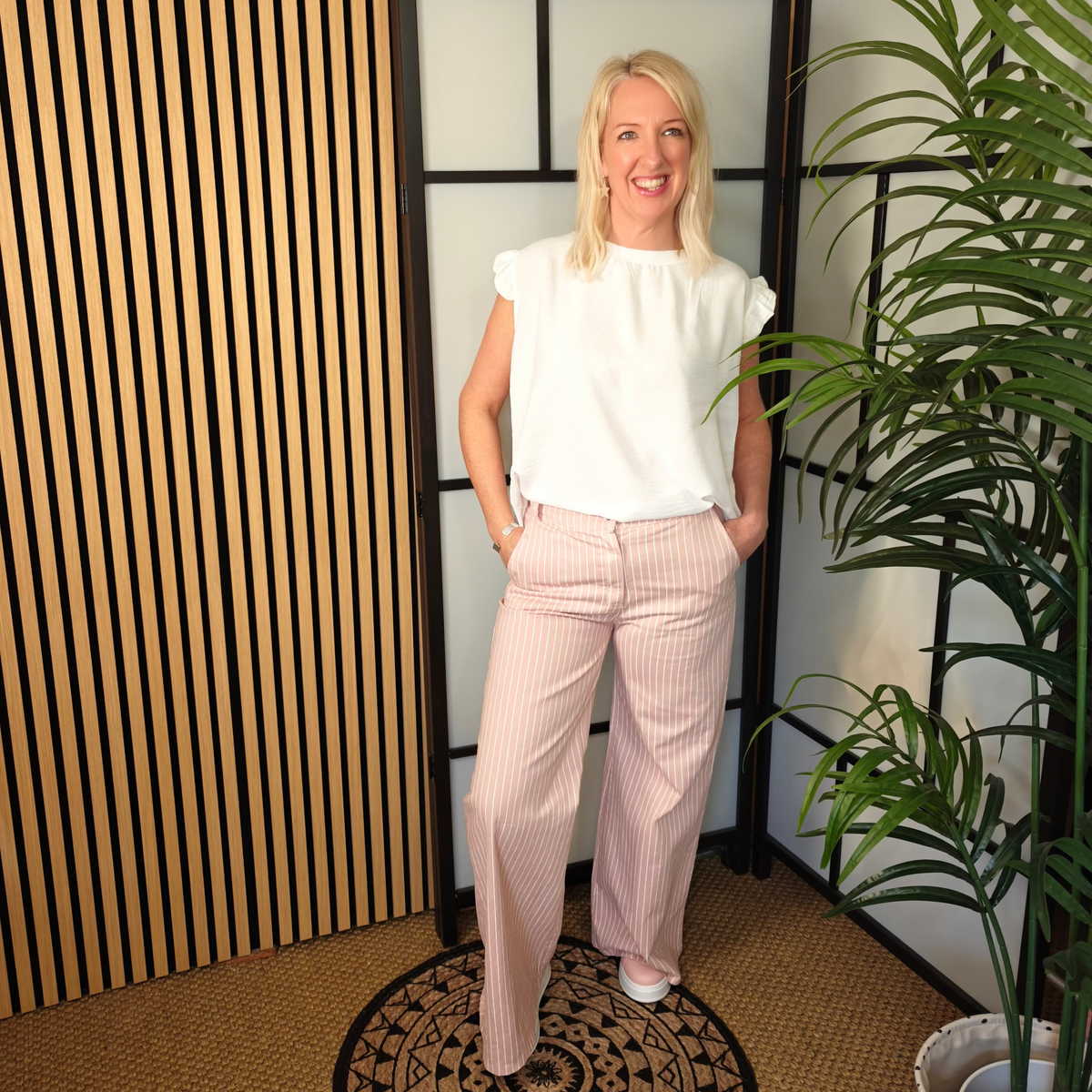 Pink jeans and white top 