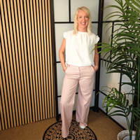 Pink jeans and white top 