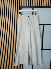 Beige jeans hanging up 