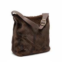  a touch of luxury to your look with this soft faux fur shoulder bag. Designed with a short PU handle for easy carrying