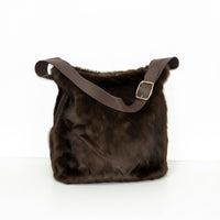  a touch of luxury to your look with this soft faux fur shoulder bag. Designed with a short PU handle for easy carrying