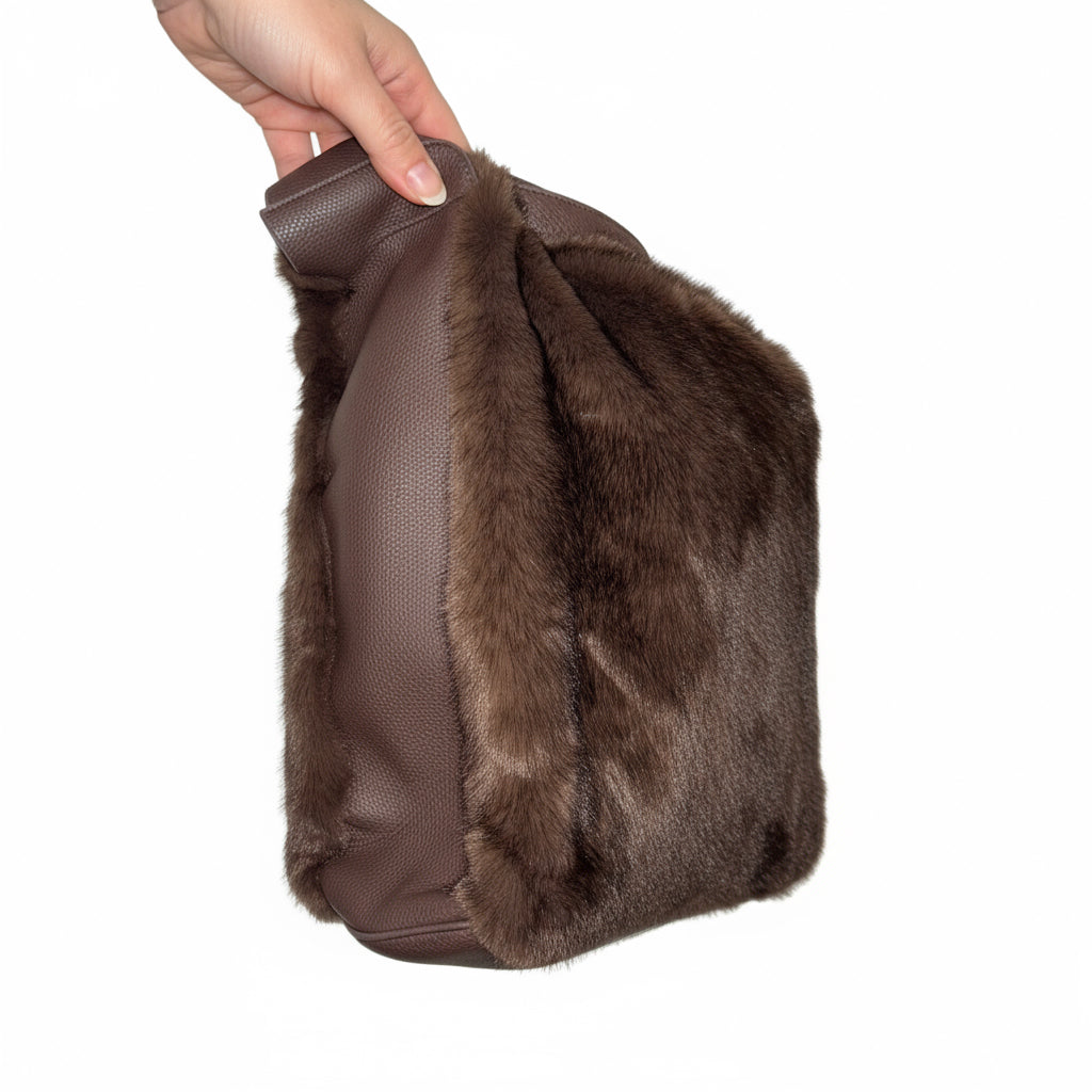  a touch of luxury to your look with this soft faux fur shoulder bag. Designed with a short PU handle for easy carrying