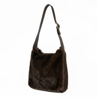  a touch of luxury to your look with this soft faux fur shoulder bag. Designed with a short PU handle for easy carrying