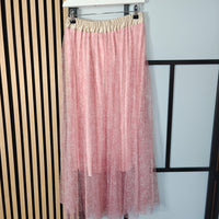Pink sheer skirt with beige waistband on a hanger against a white background