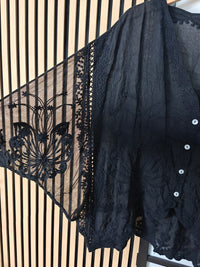 Close up image of black lace top dkeey