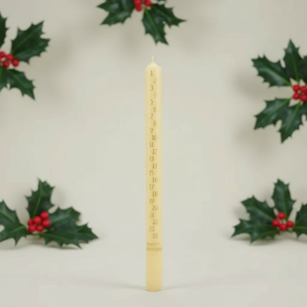 Advent Calendar Yellow candle with measurement markings on a light 
