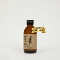 Bottle of St. Eval Pure Rosemary scented oil with a 'Best Seller' label on a light background