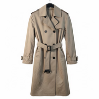 Beige trench coat on a hanger against a white background