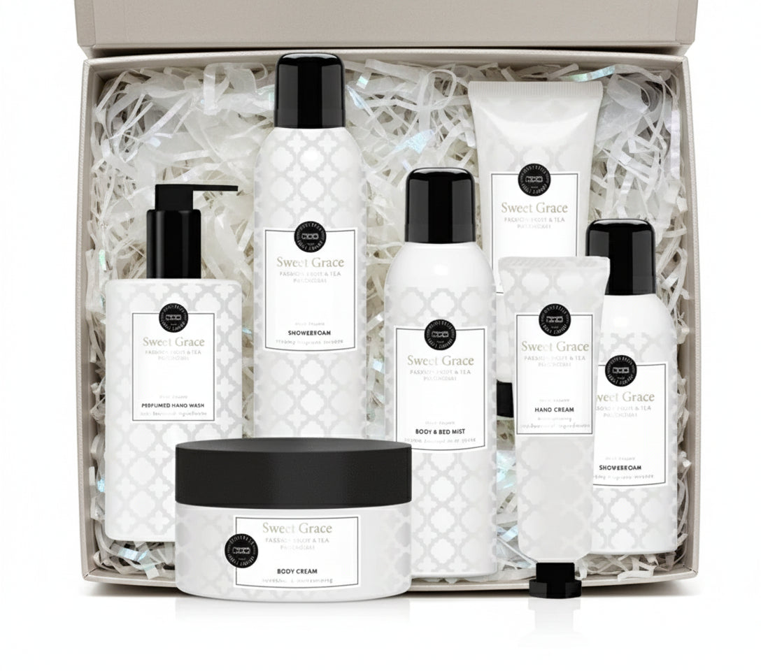 Set of white skincare products with black caps on a white background